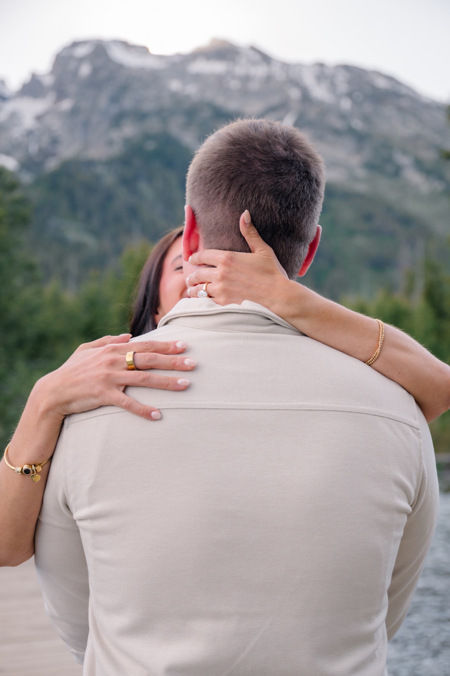 Brooke holding Michael close with her ring visible