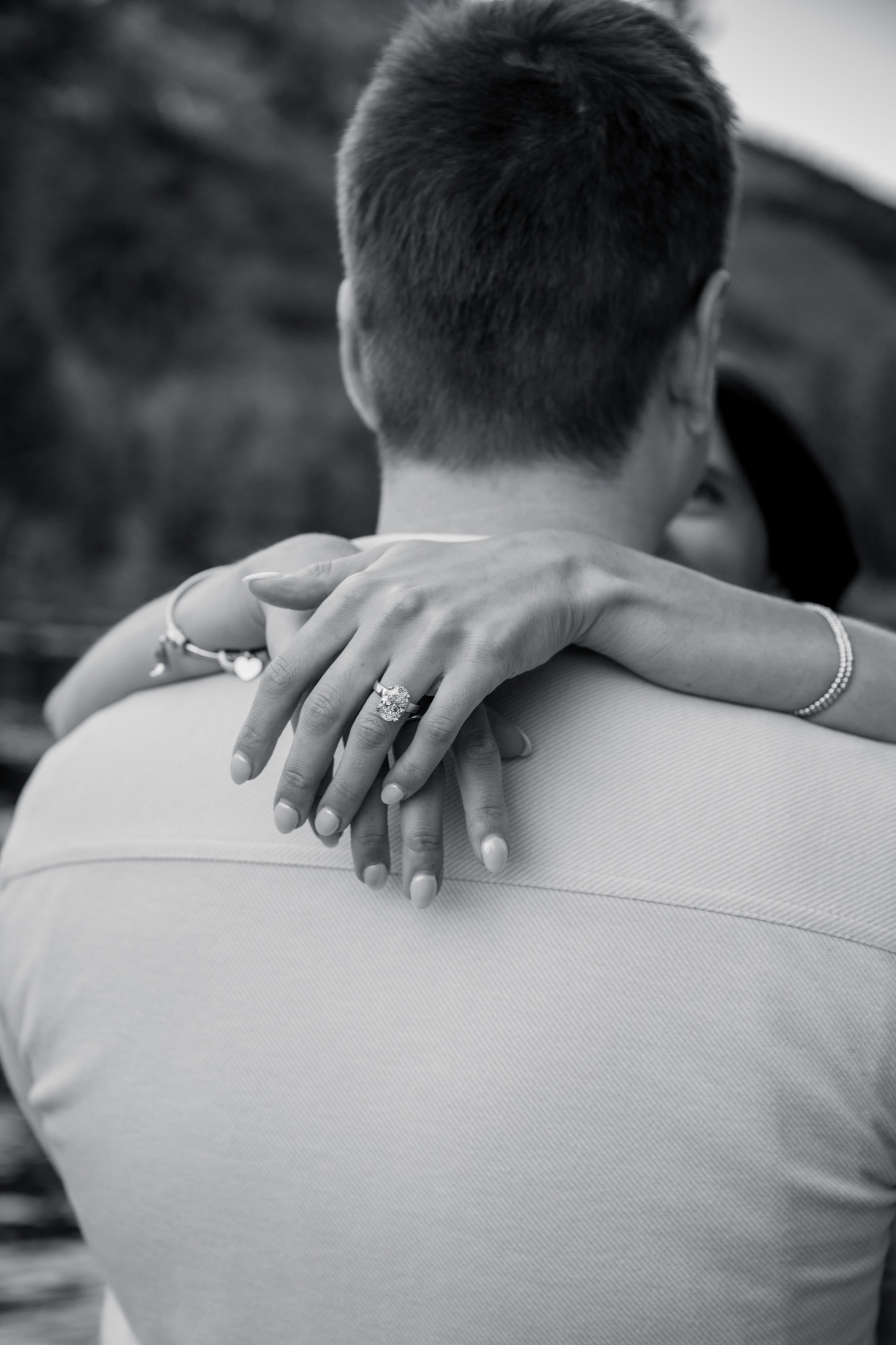 A black-and-white portrait of Brooke's ring over Michael's shoulder