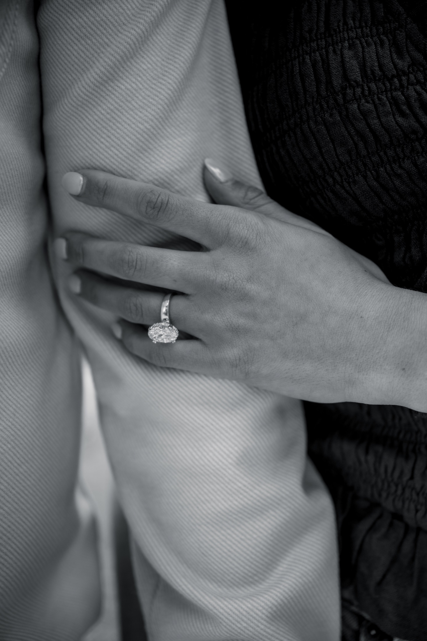 A black-and-white close-up of Brooke's engagement ring